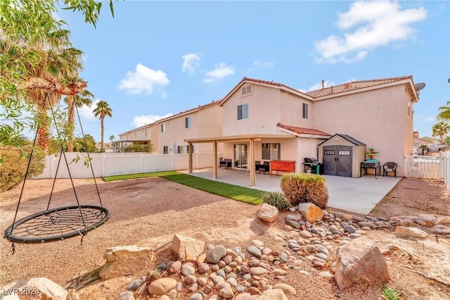 back of house featuring a patio area