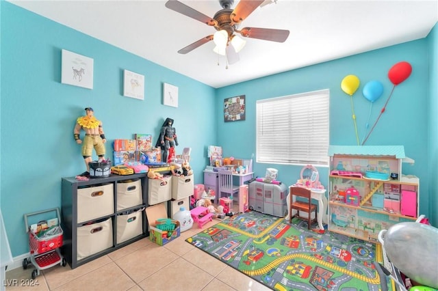 game room featuring ceiling fan and light tile patterned floors