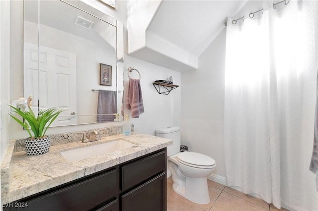 bathroom featuring tile patterned floors, vanity, and toilet