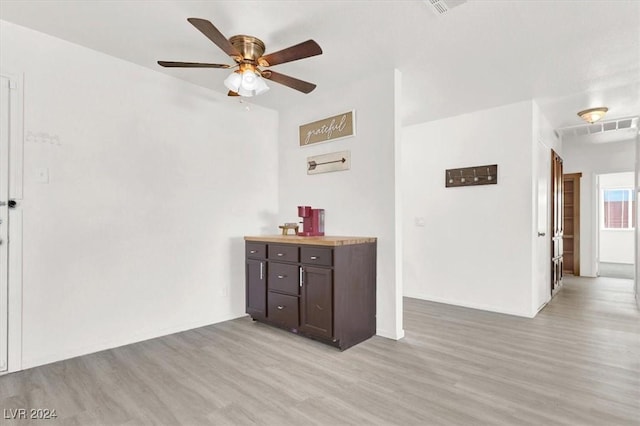 interior space featuring ceiling fan and light hardwood / wood-style flooring