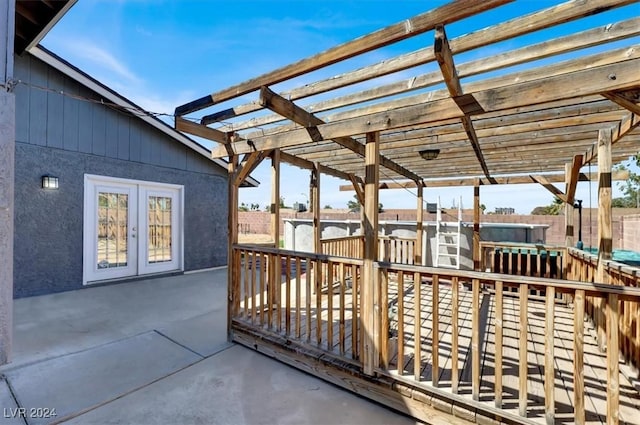 view of patio with a pergola and french doors