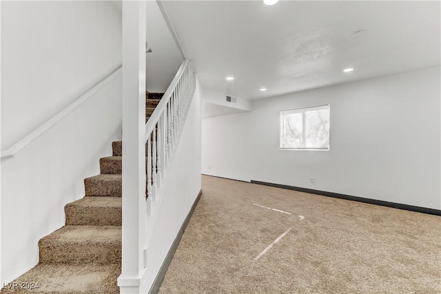 staircase with carpet flooring