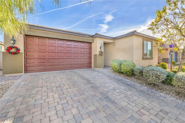 single story home featuring a garage