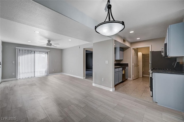 kitchen with gray cabinets, hanging light fixtures, and ceiling fan