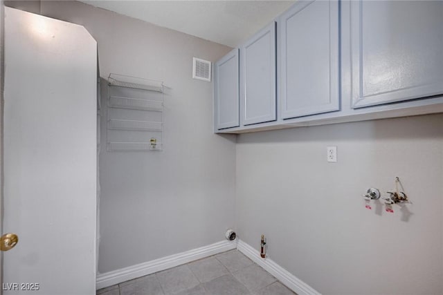 laundry room with cabinets, hookup for a washing machine, and gas dryer hookup