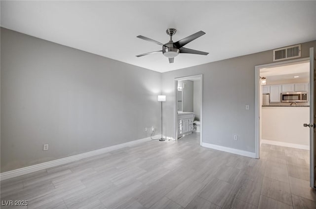 spare room with ceiling fan