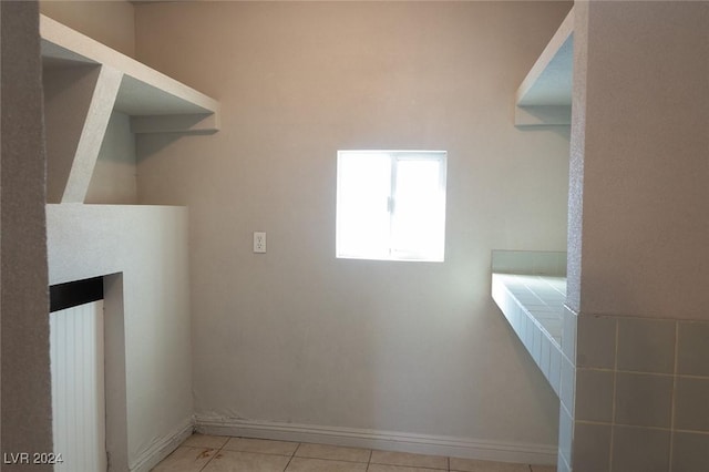 washroom with light tile patterned floors