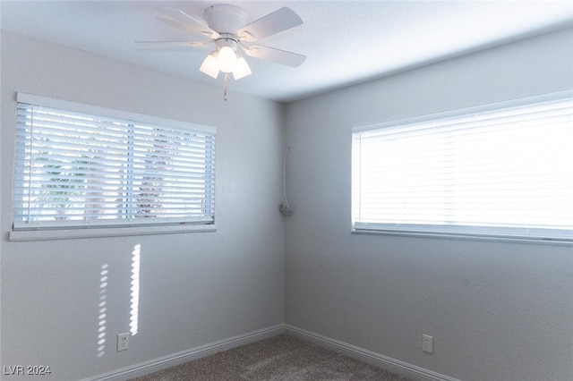 empty room with carpet flooring and ceiling fan