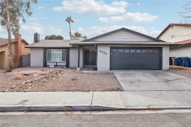 single story home featuring a garage