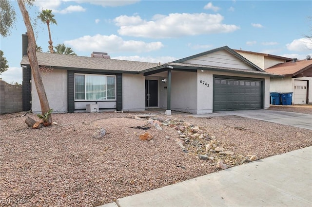 single story home featuring a garage