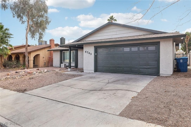 single story home featuring a garage