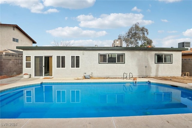 view of swimming pool featuring cooling unit