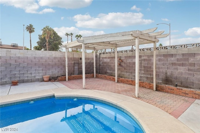 view of swimming pool featuring a pergola