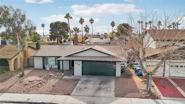 ranch-style home featuring a garage