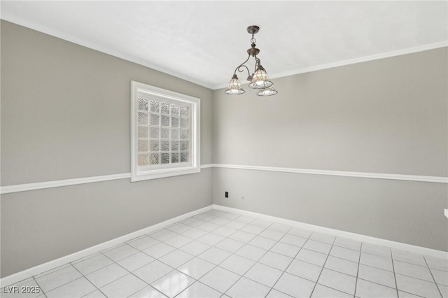 unfurnished room featuring crown molding and a notable chandelier