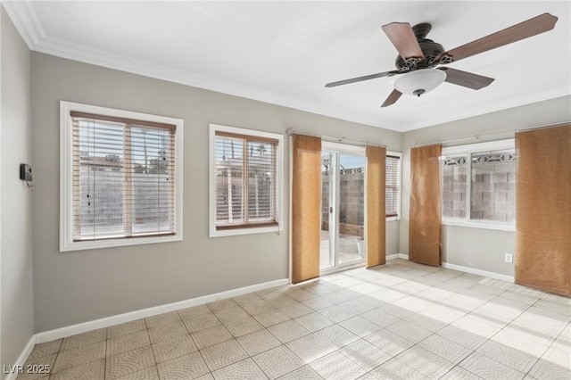 empty room featuring ornamental molding and ceiling fan