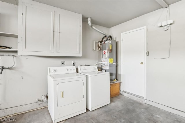 laundry room featuring cabinets, gas water heater, and washer and dryer