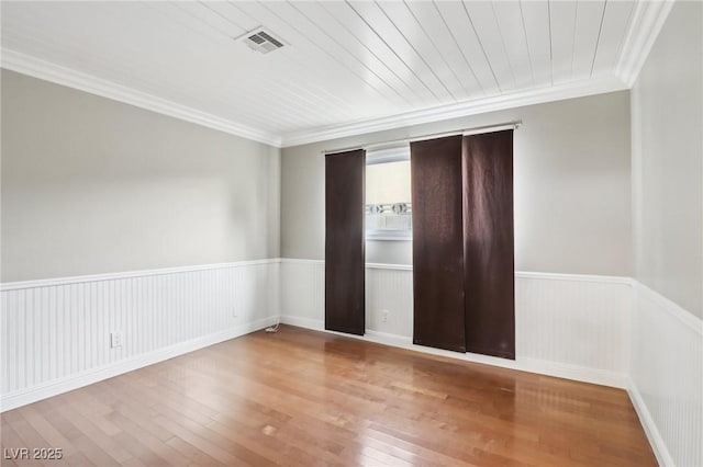 unfurnished bedroom with crown molding, hardwood / wood-style floors, and wood ceiling