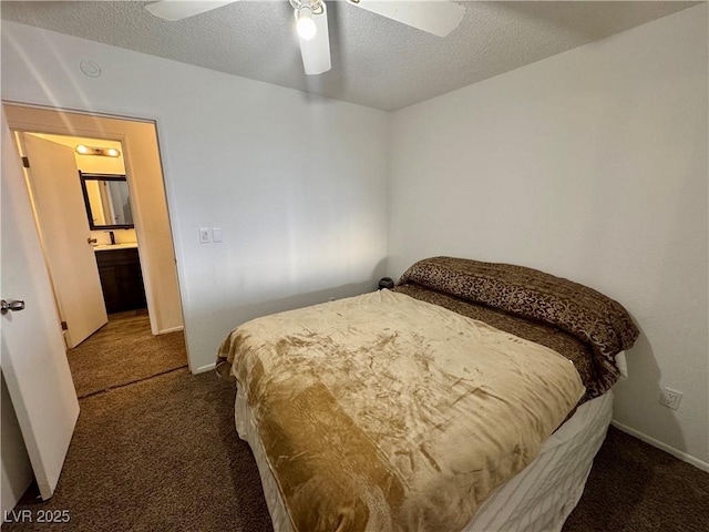 bedroom with a ceiling fan, carpet, a textured ceiling, and baseboards