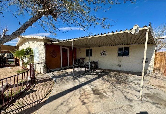 view of patio featuring fence