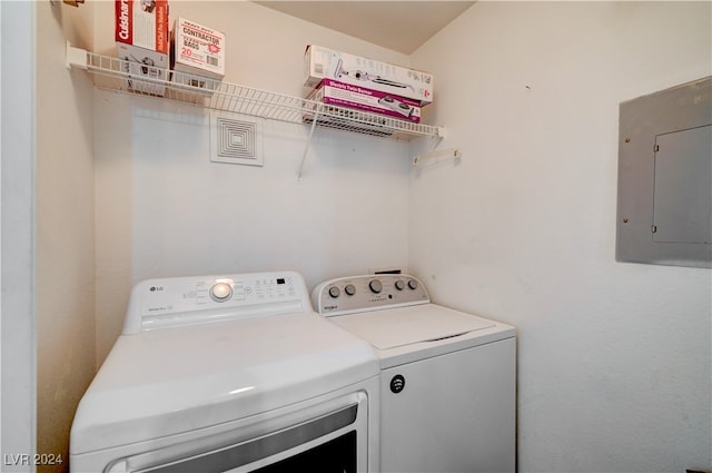 washroom featuring independent washer and dryer and electric panel