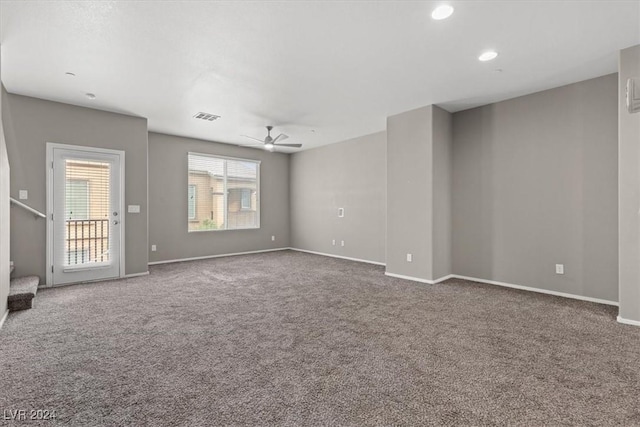 unfurnished room featuring carpet floors and ceiling fan