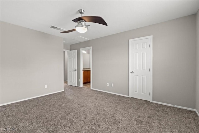 unfurnished bedroom featuring ceiling fan and carpet