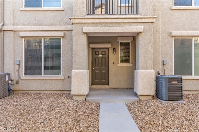 entrance to property featuring central air condition unit