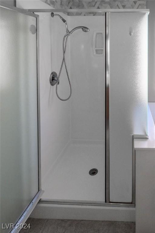 full bathroom featuring a shower stall