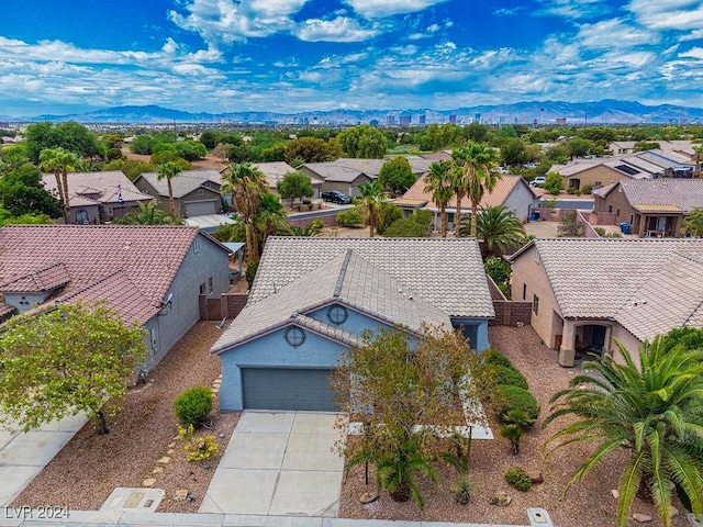 birds eye view of property with a residential view and a mountain view