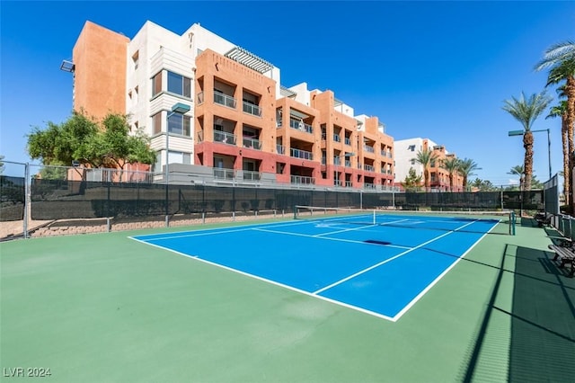 view of sport court with basketball hoop