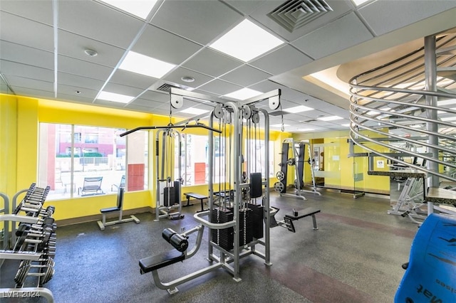 gym featuring a drop ceiling