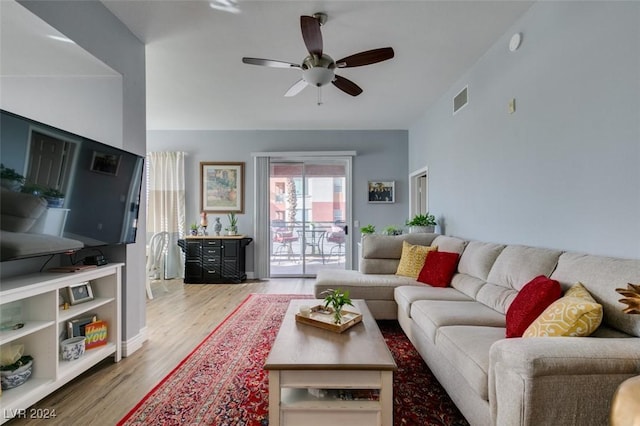 living room with ceiling fan and light wood-type flooring