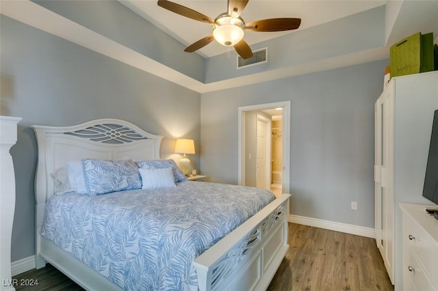 bedroom featuring light hardwood / wood-style flooring and ceiling fan