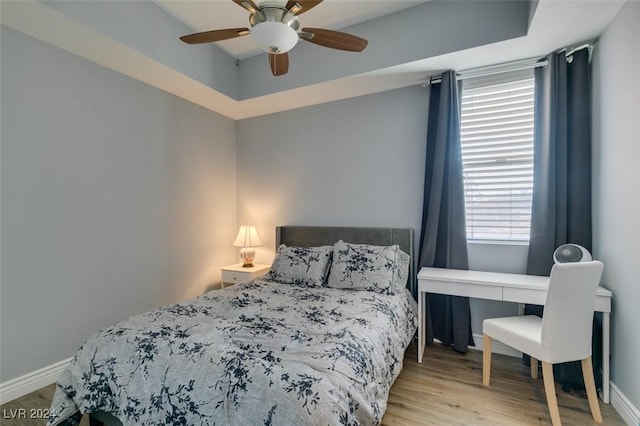 bedroom featuring ceiling fan and light hardwood / wood-style floors