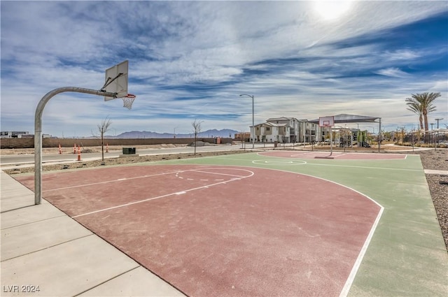 view of sport court featuring community basketball court and a mountain view