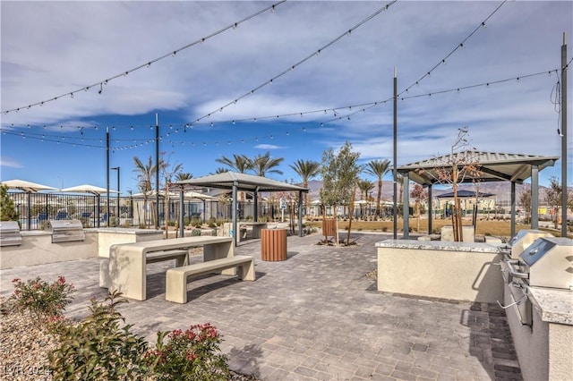 view of patio with a gazebo, area for grilling, and grilling area