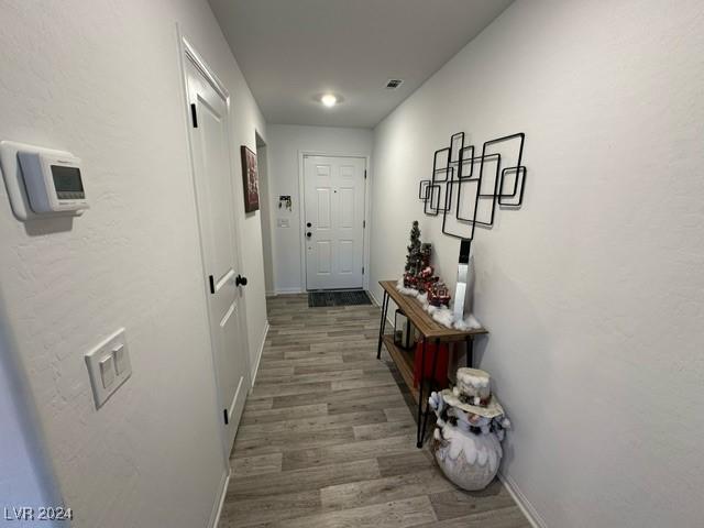 hallway featuring dark wood-type flooring