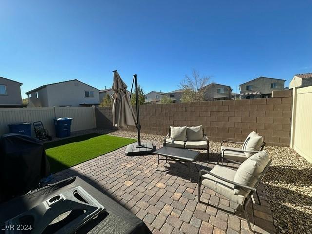 view of patio / terrace with a fenced backyard and an outdoor living space