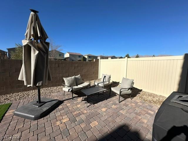 view of patio featuring a fenced backyard and outdoor lounge area