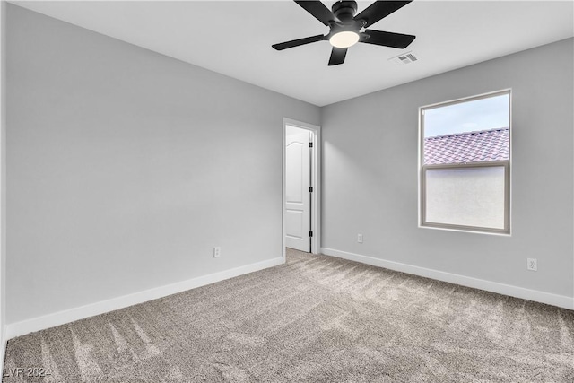 unfurnished room with ceiling fan and carpet floors