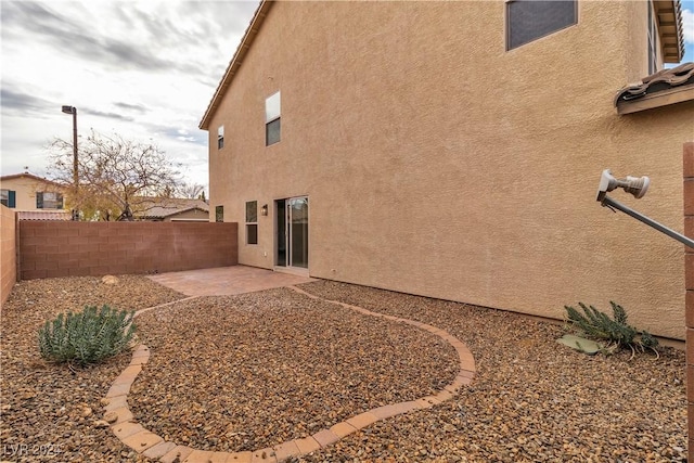 back of property featuring a patio area