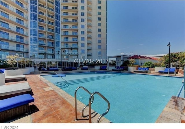 view of swimming pool featuring a patio