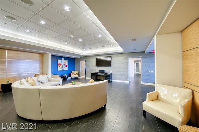 living room with a raised ceiling