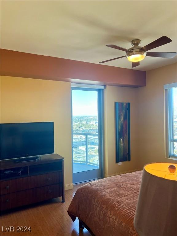 bedroom featuring light hardwood / wood-style flooring and ceiling fan