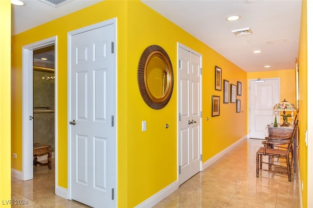 corridor with light tile patterned floors