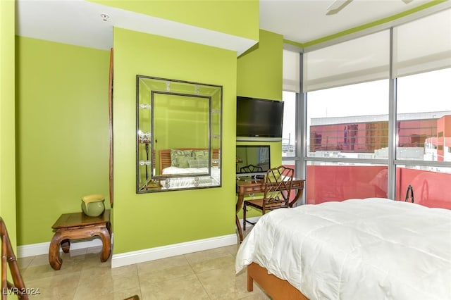 bedroom with light tile patterned floors