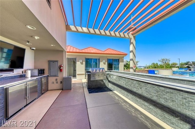 view of patio with a pergola, area for grilling, an outdoor kitchen, and visible vents