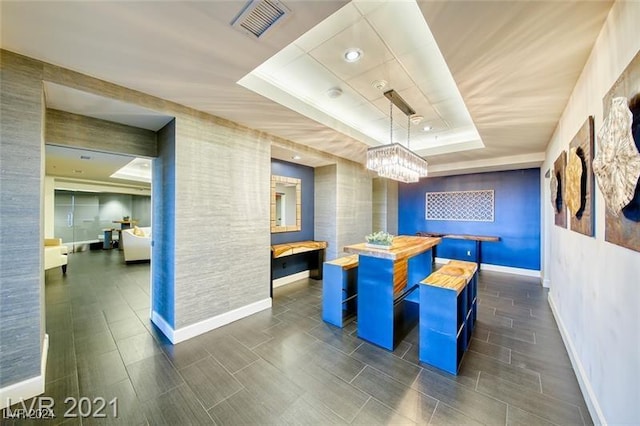 interior space featuring a notable chandelier and visible vents