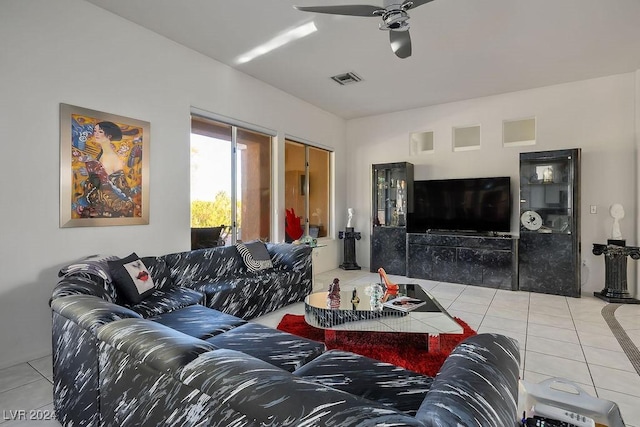 tiled living room featuring ceiling fan